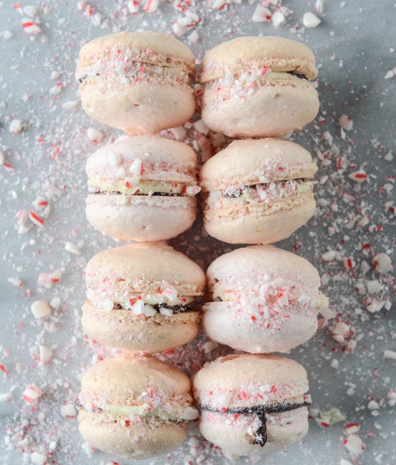 Pink peppermint bark macarons from How Sweet It Is