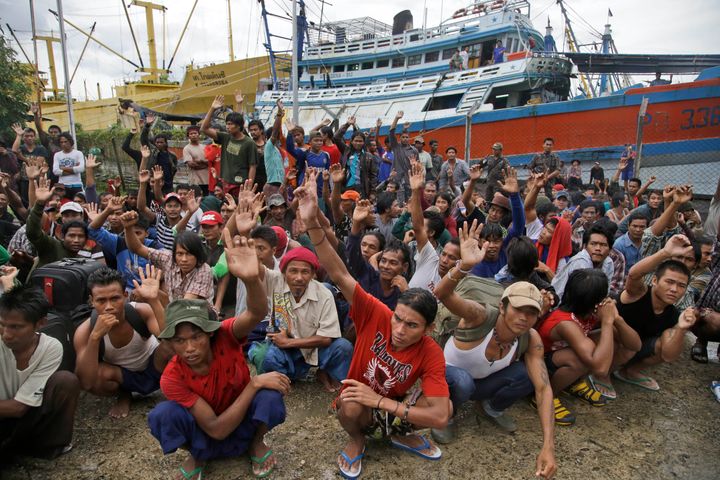 The men in this photo have just been asked “who wants to go home?” by the Indonesian authorities who came to rescue them. The men, mostly from Myanmar, had been trafficked for work on Thai fishing boats. Beaten with sting-ray tails, shocked with Taser-like devices at sea, forced to work almost non-stop without clean water or proper food, they had been paid little or nothing and prevented from leaving.