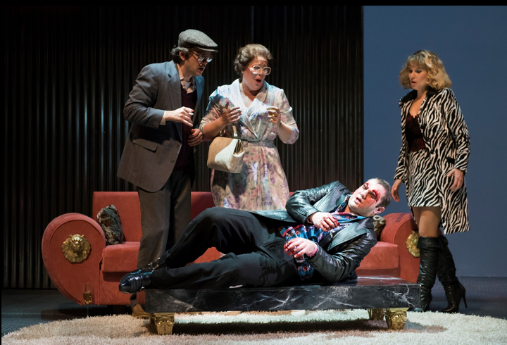 Playing out his apparent Oedipal fate, Eddy (Marcus Farnsworth, on table) reacts to disturbing news by attempting to gouge his own eyes as his parents (Christopher Burchett and Caroline Worra) and his wife (Amanda Crider) look on in horror.