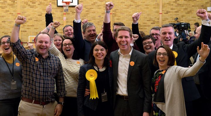 Newly elected MP for Richmond Park Sarah Olney (C) celebrates with her husband Ben (2nd R)