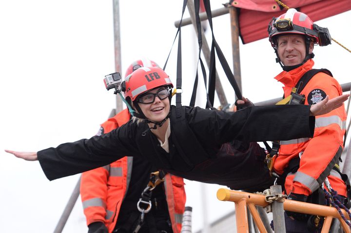 Model Rosie Tapner prepares to zip wire across the Thames