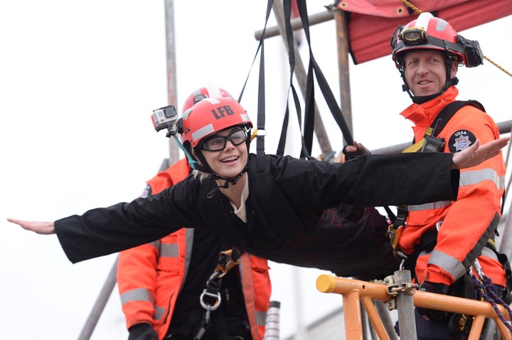 Model Rosie Tapner prepares to zip wire across the Thames