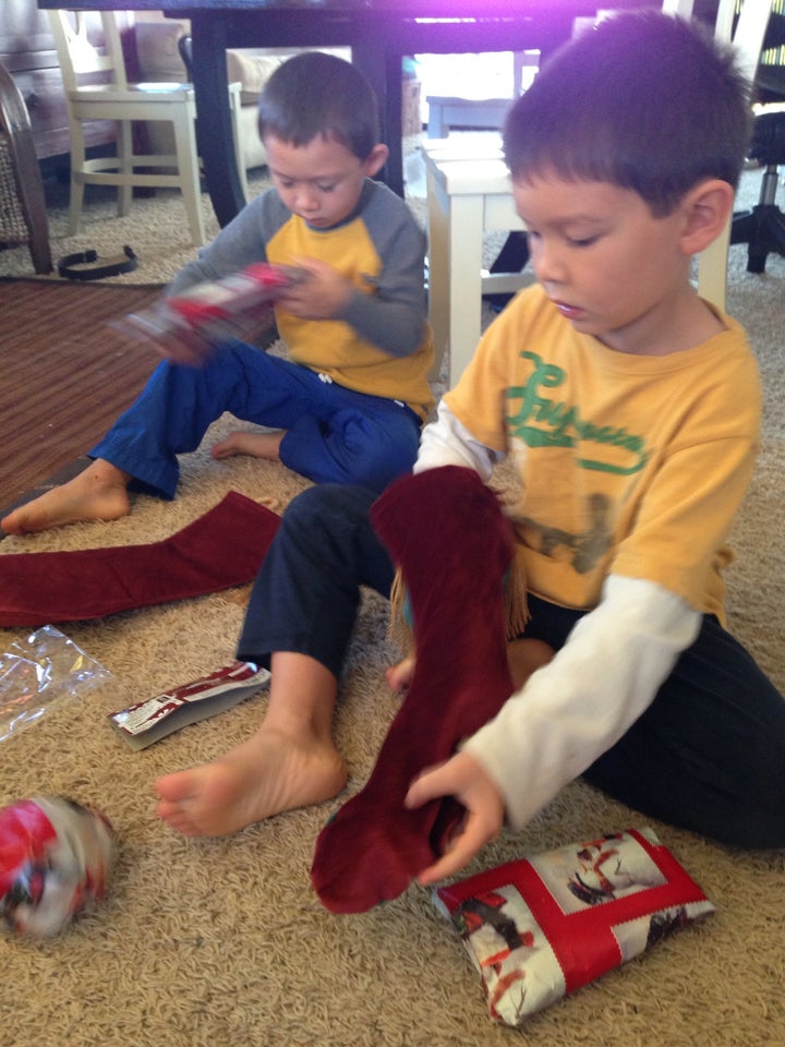 Boys Rip Open Christmas Stocking Gifts at Frenzied Pace