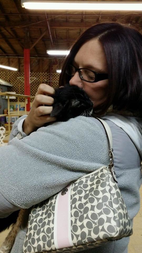 A woman embraces a cat she feared she had lost in the Tennessee wildlfires.