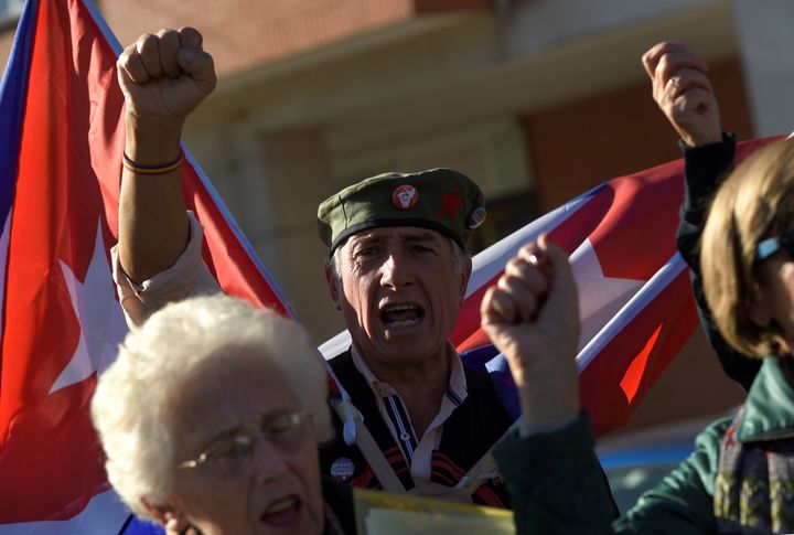 Supporters of late Cuban revolutionary leader Fidel Castro shout slogans during a tribute held today in Havana square in Gijon, northern Spain December 3, 2016.