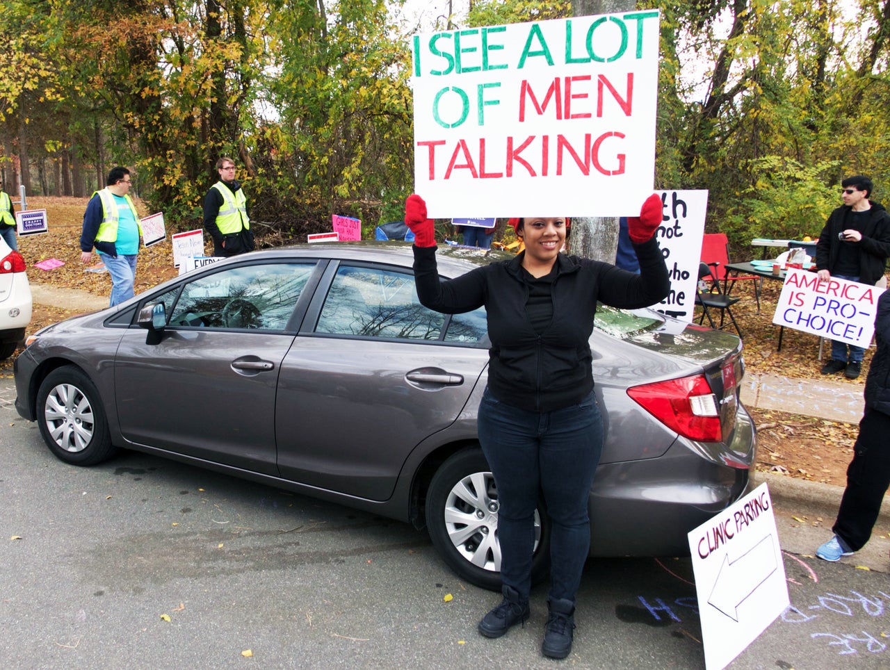 A pro-choice protester holds a sign during the Cities For Life prayer march.