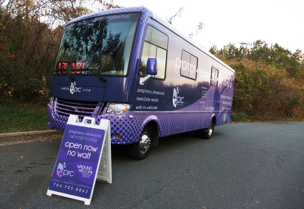 One of the two PRC Charlotte mobile crisis pregnancy centers parks just up the road from APWHC Charlotte. 