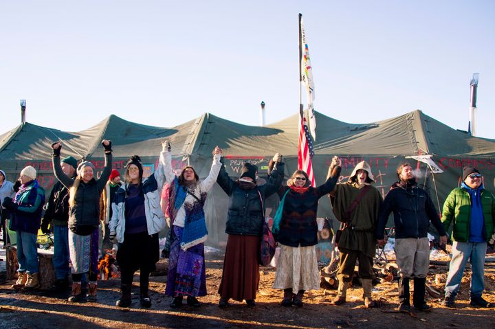 Activists celebrate at Oceti Sakowin Camp on the edge of the Standing Rock Sioux Reservation.