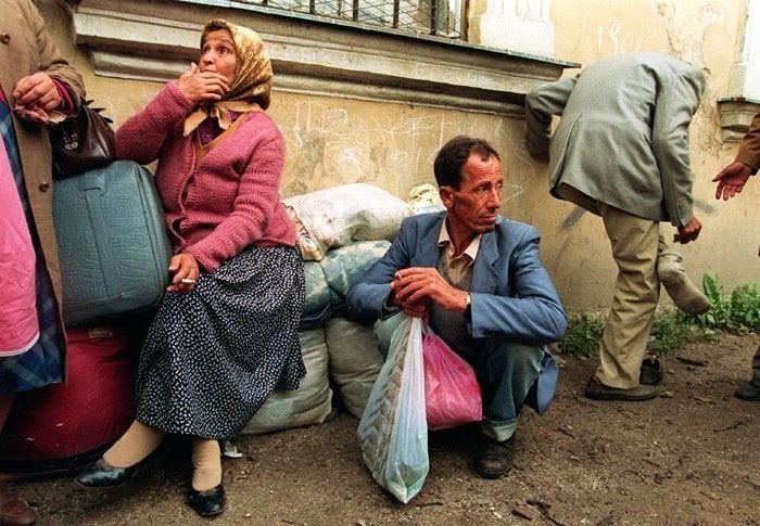 Bosnian families from neighboring towns arrive in Travnik, Bosnia, in July 1993. About 131,000 Bosnians were resettled in the