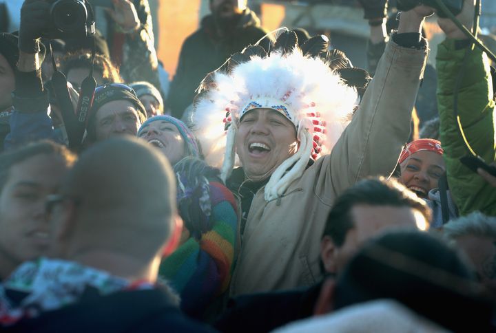 Native American and other activists celebrate.