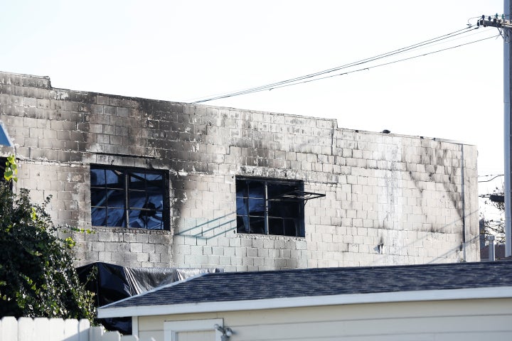 Broken windows are seen after a blaze gutted the warehouse in Oakland, California. 