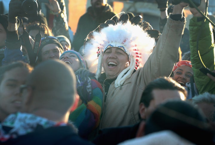 Native American and other activists celebrate after learning an easement had been denied for the Dakota Access Pipeline at Oceti Sakowin Camp on the edge of the Standing Rock Sioux Reservation on December 4, 2016 outside Cannon Ball, North Dakota. The US Army Corps of Engineers announced today that it will not grant an easement to the Dakota Access Pipeline to cross under a lake on the Sioux Tribes Standing Rock reservation, ending a months-long standoff.