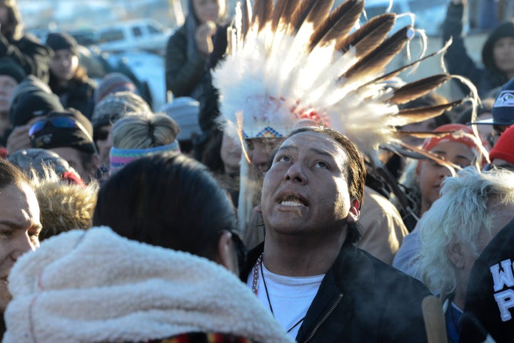 People celebrate in Oceti Sakowin camp.