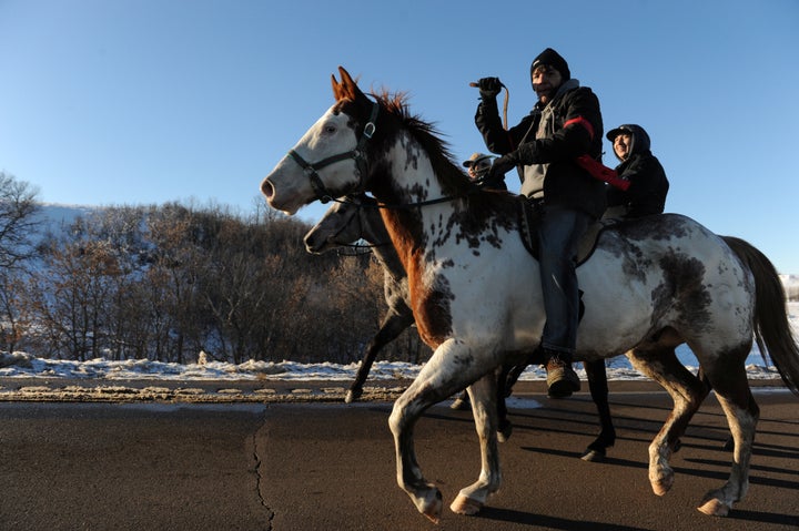 People celebrate in Oceti Sakowin camp as "water protectors" continue to demonstrate against plans to pass the Dakota Access pipeline near the Standing Rock Indian Reservation.