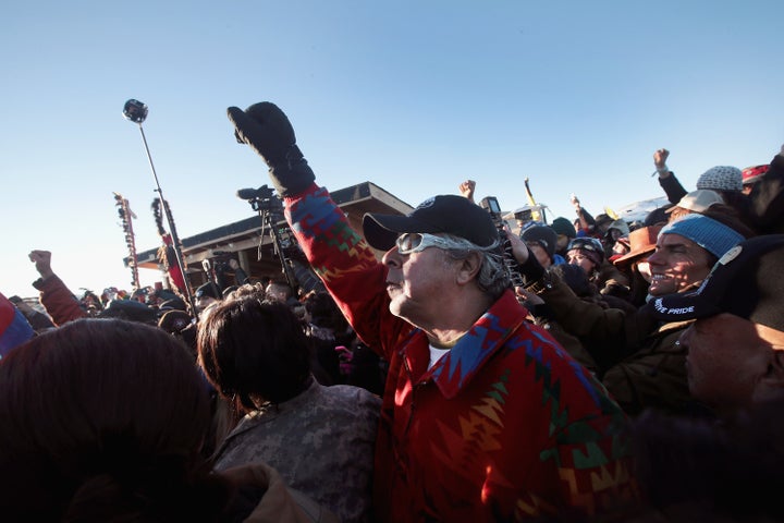 Native American and other activists celebrate after learning an easement had been denied.