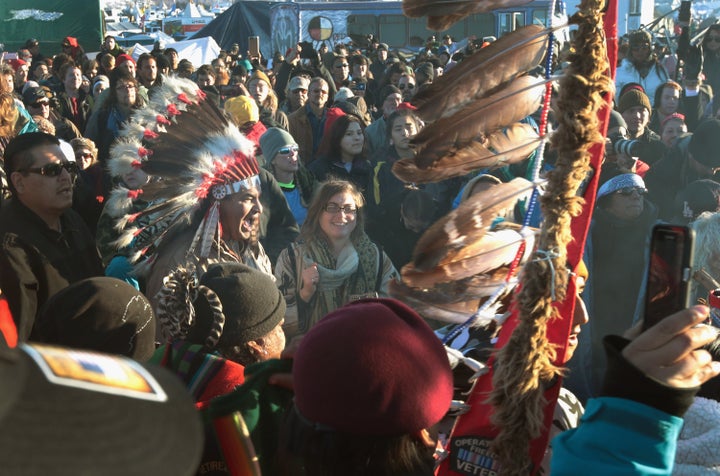 Native American and other activists celebrate.