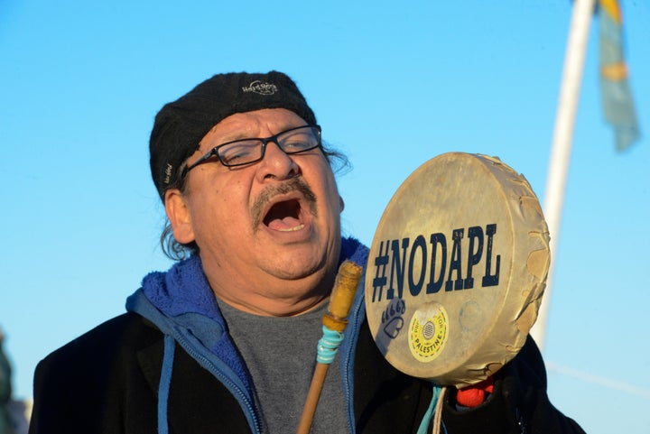 A person celebrates in Oceti Sakowin camp.