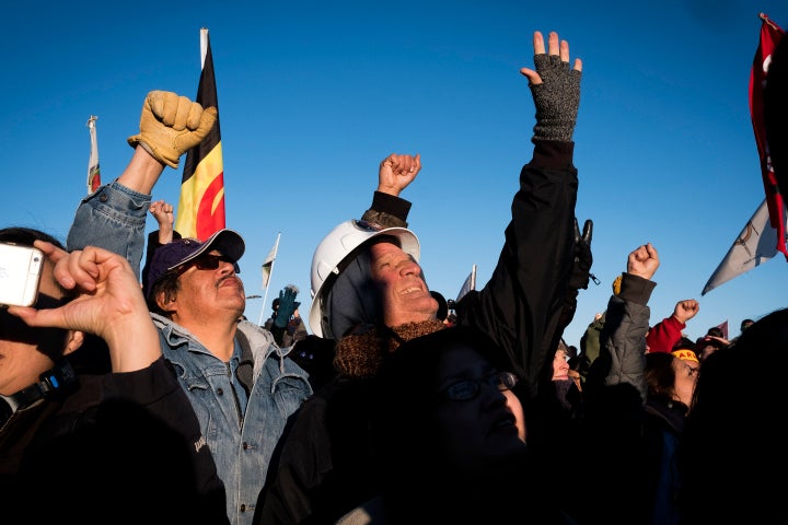 Dakota Access Pipeline protesters celebrate after learning that the Army Corps of Engineers denied the drilling permit to drill under Lake Oahe near Cannon Ball, North Dakota.