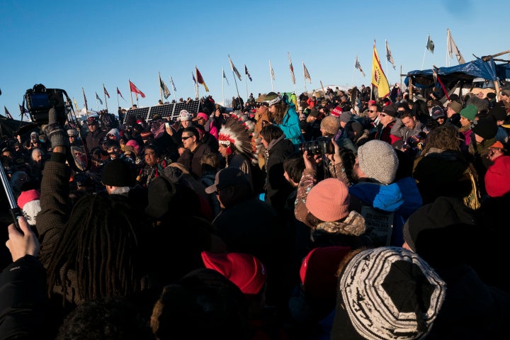 Thousands gather in the main area of the Oceti Sakowin campground to celebrate after the Army Corps of Engineers announced they will not be granting a drilling permit.