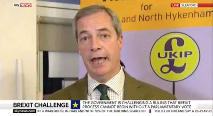 <strong>Farage with poster for Sleaford and North Hykeham campaign in background.</strong>
