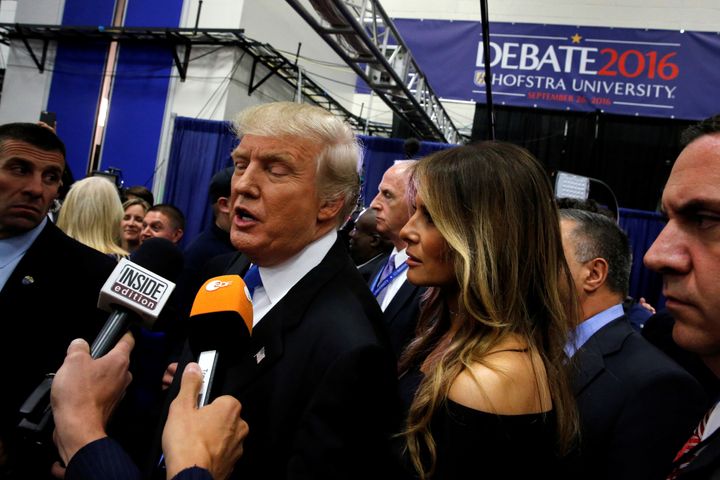 Republican U.S. presidential nominee Donald Trump, with his wife Melania, talks to reporters in a file photo from September.