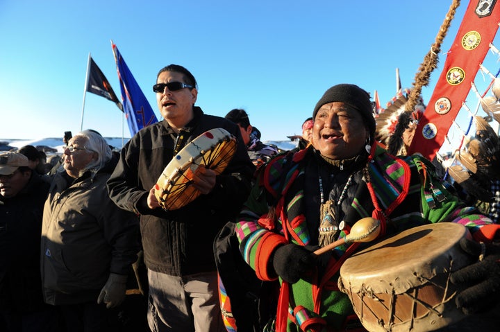 People celebrate in Oceti Sakowin camp as "water protectors" continue to demonstrate against plans to pass the Dakota Access pipeline near the Standing Rock Indian Reservation, near Cannon Ball, North Dakota, U.S. December 4, 2016.