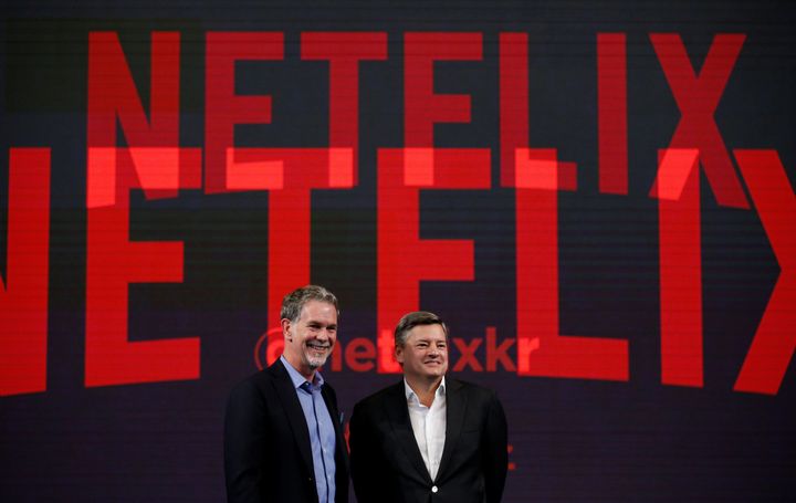 Reed Hastings, co-founder and CEO of Netflix, and Ted Sarandos, Netflix chief content officer, pose for photographs in Seoul, South Korea on June 30.