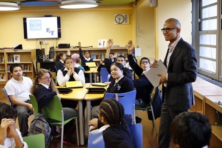 Microsoft CEO Satya Nadella meets with students at the Laboratory School of Finance and Technology, Wednesday, Dec. 10, 2014, in the Bronx borough of New York.
