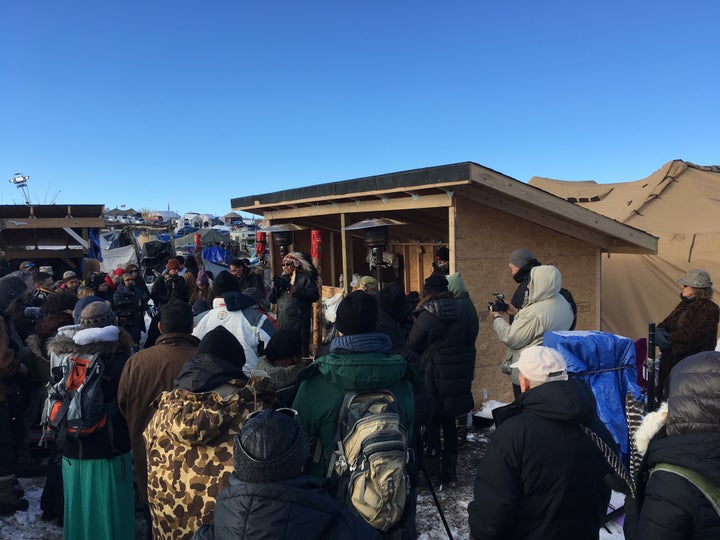 An interfaith prayer event takes place at the Oceti Sakowin camp. 