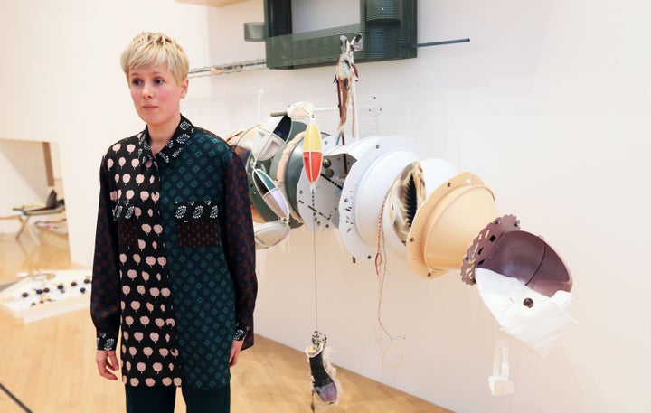 Helen Marten, winner of the 2016 Turner Prize, in front of her installation at Tate Britain, London.