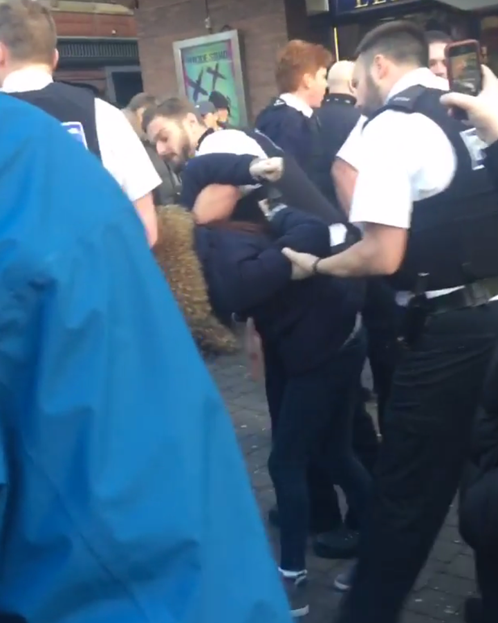<strong>Police are seen arresting one of the three teenagers in Liverpool on Monday</strong>