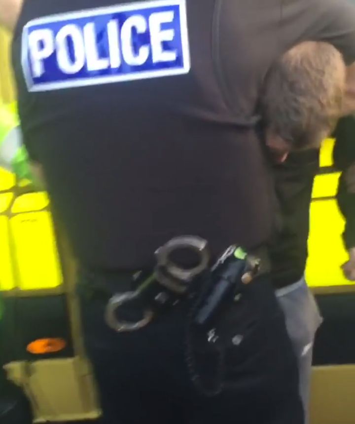 <strong>One of the teenagers is seen being restrained before he is arrested</strong>