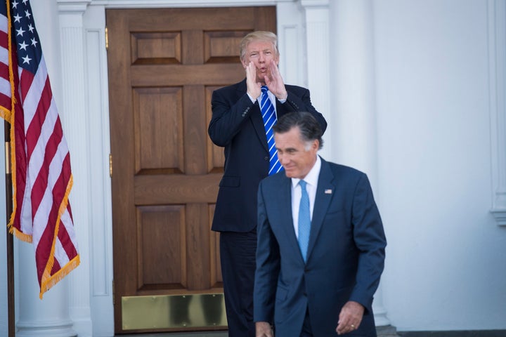 President-elect Donald Trump calls out to the media as Mitt Romney walks out after a meeting at the Trump National Golf Club Bedminster clubhouse at Trump National Golf Club Bedminster in Bedminster Township, N.J. on Saturday, Nov. 19, 2016. (Photo by Jabin Botsford/The Washington Post via Getty Images)