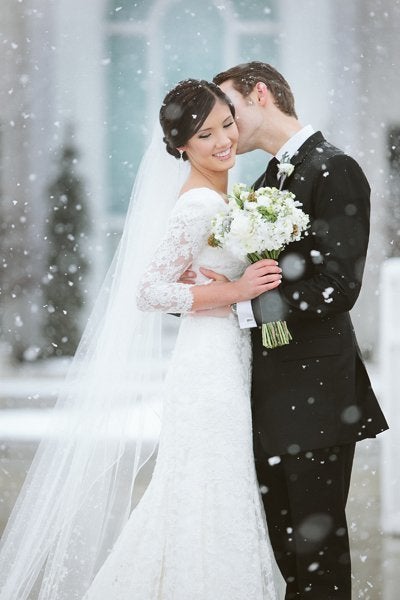 <p>There’s nothing like a <a href="http://bridalguide.com/planning/the-details/season/winter-wonderland-wedding" target="_blank">light snowfall</a> to add a bit of romance and create a classic winter wedding photo.</p>