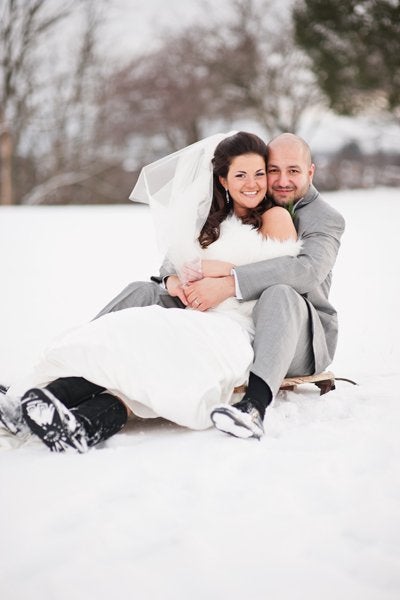 <p>A sled acts as a fun prop with playtime vibes, bringing out this couple’s <a href="http://www.bridalguide.com/planning/the-details/photo-video/funny-wedding-photos" target="_blank">inner child</a>.</p>