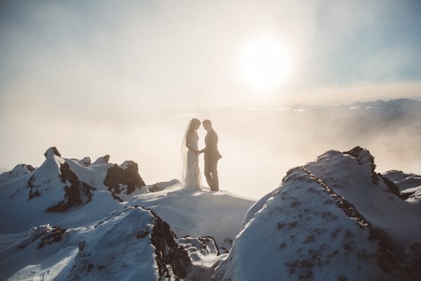 <p>Climbing up a snow-capped mountaintop with a bright winter sun, heavenly light, and wisps of clouds is worth it for such a <a href="http://bridalguide.com/planning/the-details/photo-video/best-wedding-photos-around-the-world" target="_blank">jaw-dropping and otherworldly picture</a>. </p>