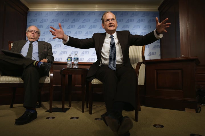 Harvard Law School professor and former 2016 Democratic presidential candidate Lawrence Lessig (right) discusses campaign finance reform with Norman Ornstein. Lessig is heading a new project to give free legal counsel to faithless electors.