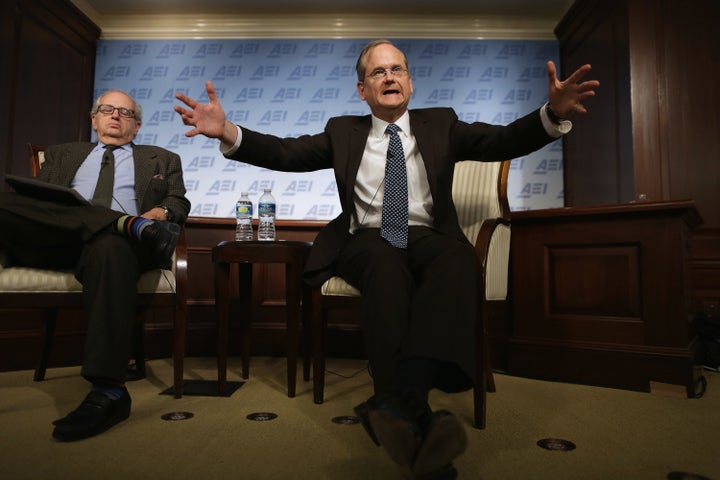 Harvard Law School professor and former 2016 Democratic presidential candidate Lawrence Lessig (right) discusses campaign finance reform with Norman Ornstein. Lessig is heading a new project to give free legal counsel to faithless electors. 