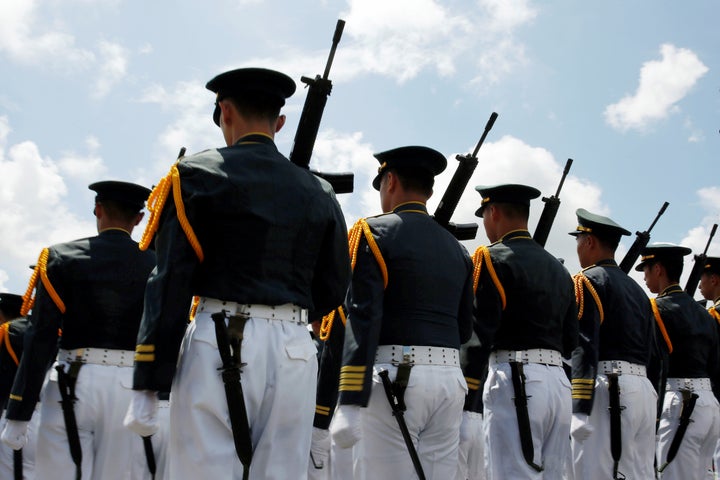 Taiwanese cadets march during a ceremony to mark the 92nd anniversary of the Whampoa Military Academy, in Kaohsiung, southern