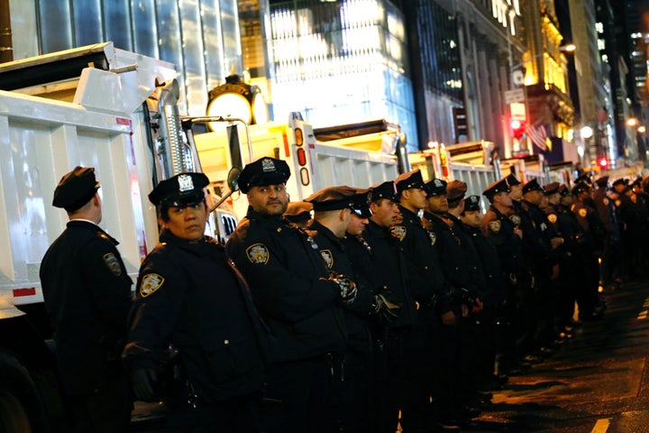 NYPD officers stand guard during a protest against President-elect Donald Trump in New York on November 9, 2016.