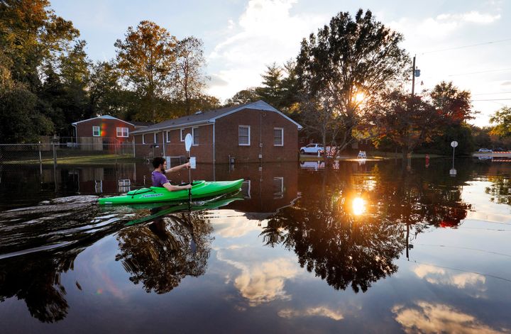 A man paddles his kayak in the aftermath of Hurricane Matthew -- an extreme weather event -- in Greenville, North Carolina, this year.