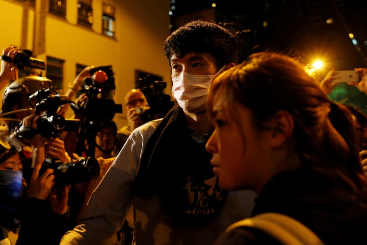 Pro-independence legislator-elects Sixtus "Baggio" Leung (C) and Yau Wai-ching (R) during a confrontation with the police on