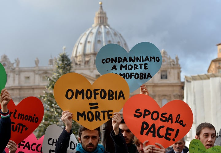 Italian gay rights activists demonstrate in front of the Vatican on December 16, 2012, to protest against Pope Benedict's comments regarding the church's opposition to gay marriage.