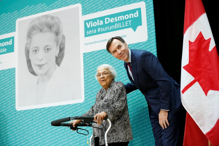 Finance Minister Bill Morneau announces on Thursday Viola Desmond will be featured on Canada's next $10 bill. He is pictured here with Desmond's sister, Wanda Robson.