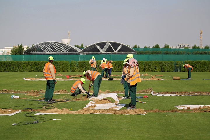 Workers test soil as they grow grass for Qatar's 2022 World Cup, at an experimental facility in Doha, Qatar November 29, 2016.