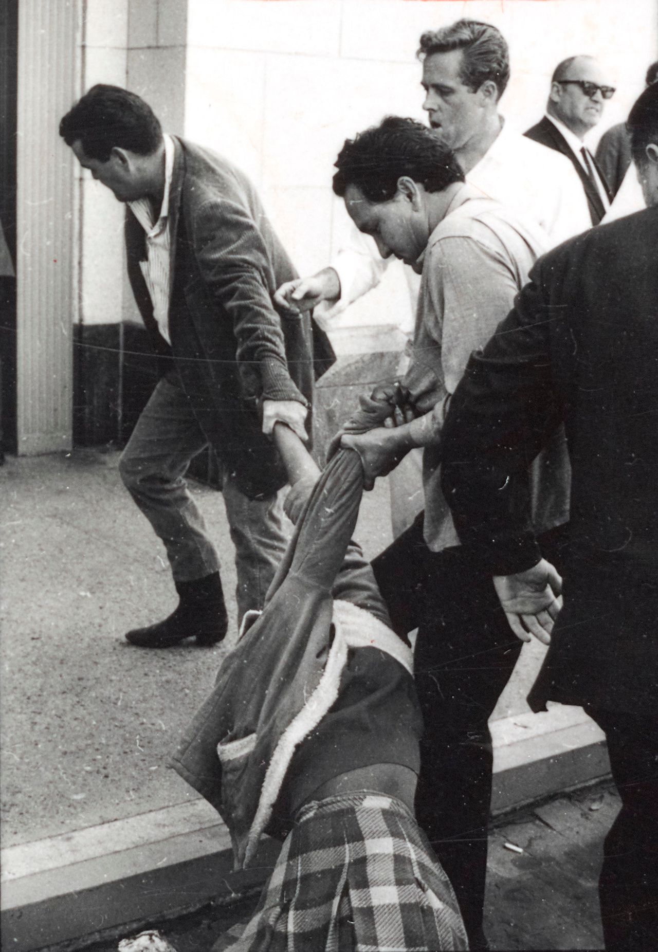Protesters being physically removed during a demonstration against the shocking violence in Selma in March 1965. No clouds of tear gas or swinging clubs are present in these scenes outside the Federal Building in downtown Los Angeles, but Brittin’s tight focus immediately draws viewers into one of the most dramatic struggles he documented for CORE.