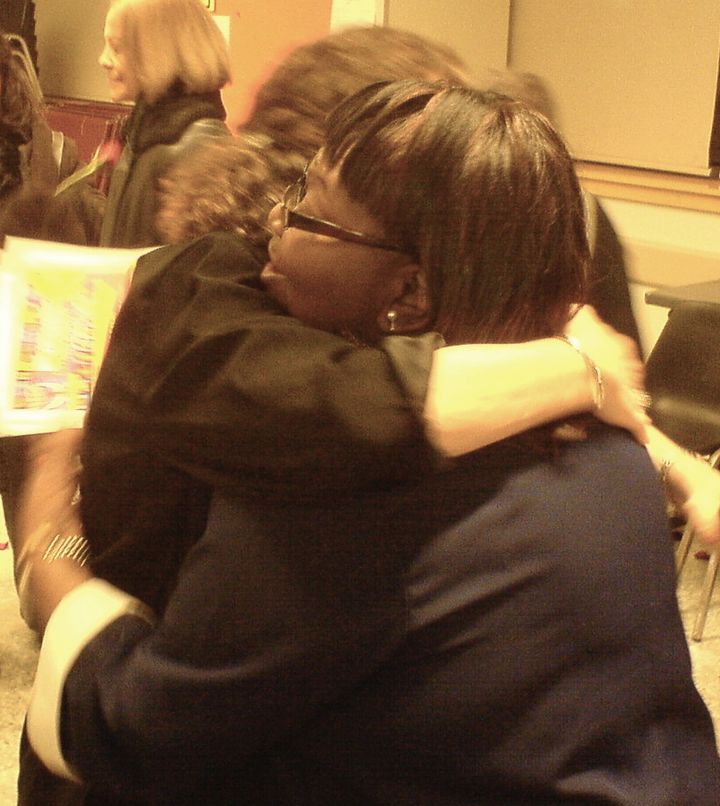 A heartfelt hug at the close of a program