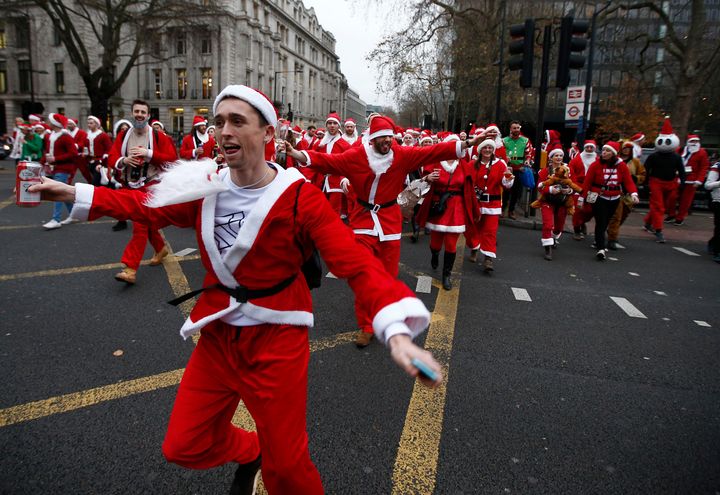 Santas take part in the Santacon event in London.