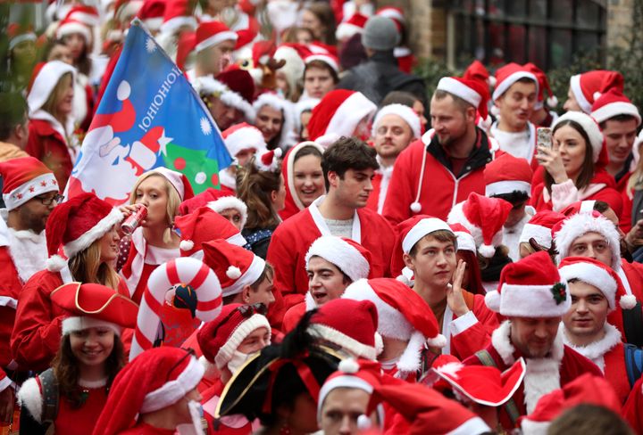 Thousands head to the Santacon Christmas parade.
