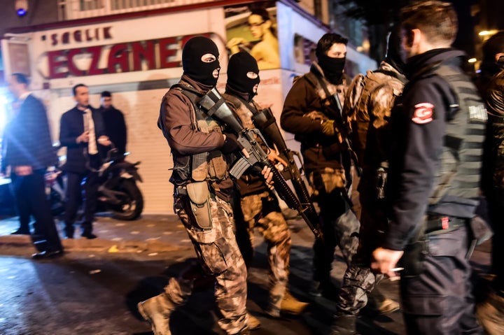 Turkish special force police officers patrol streets after a car bomb exploded near the stadium of football club Besiktas